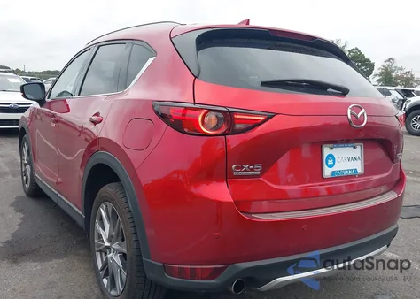 2021 Mazda Cx-5 Signature z USA, uszkodzony, nr VIN JM3KFBEY6M0430937